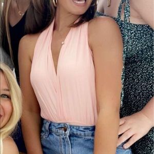 Revolve pink bodysuit